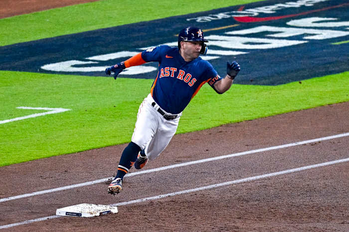 Jose Altuve rounds first base and heads for second for a leadoff double in Game 2 of the World Series.